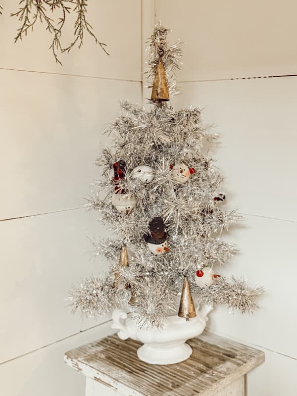 DIY Faux Vintage Aluminum Christmas tree decorated with vintage ornaments. 