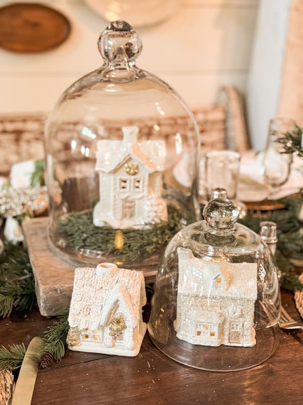 Christmas Houses Village under glass cloches as centerpiece on Holiday Dining Table.  