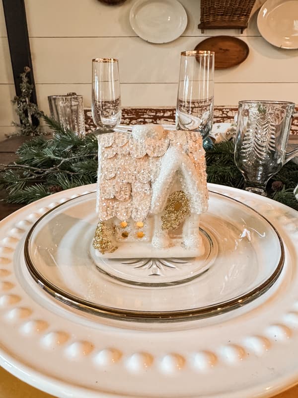 Christmas House with old book page roof on dining room dinner plate 