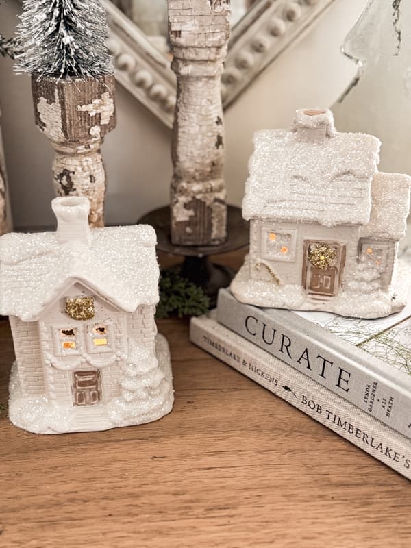 After - upcycled Christmas Houses Village with crystal and gold glitter on entry table in farmhouse.