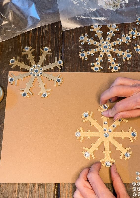 Adding rhinestones to Dollar Tree Christmas Snowflake ornaments