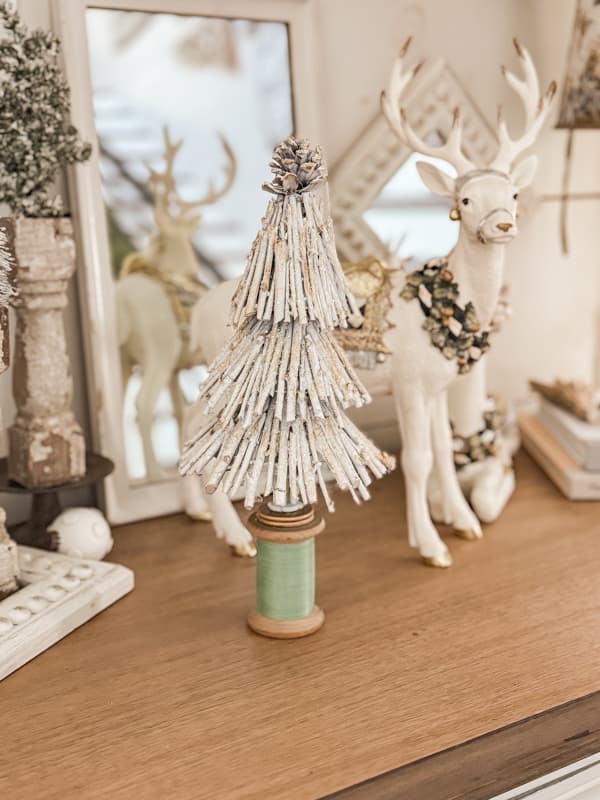 DIY Twig Christmas Tree with reindeers on entry table