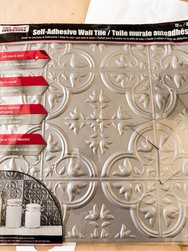 $1.25 Dollar Tree Wall Tile to make Vintage Inspired Metal Christmas ornaments.