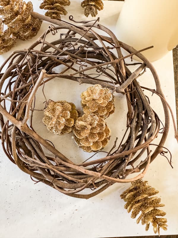 Foraged Grapevine and glitter gold pinecones.