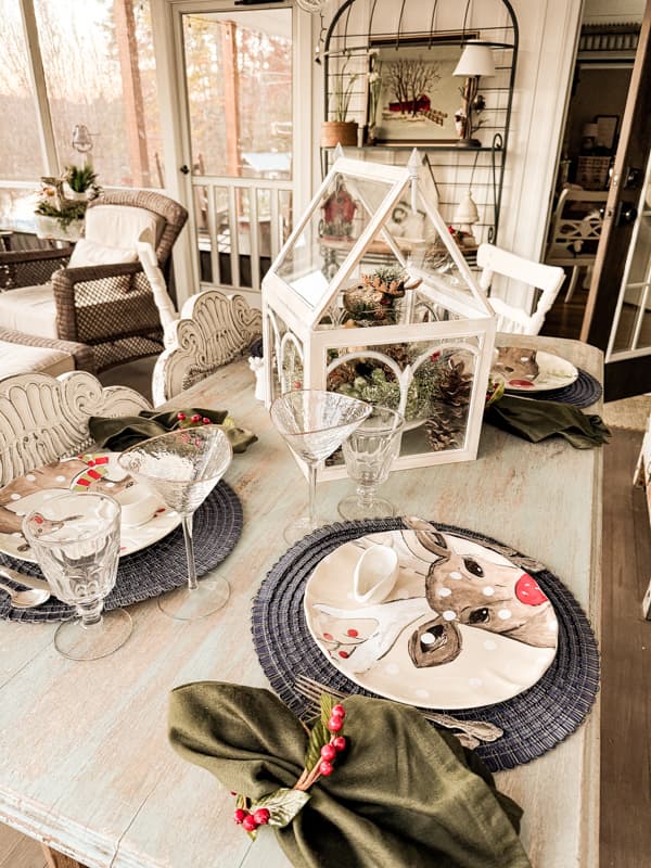 Reindeer dishes on outdoor porch dining table.  