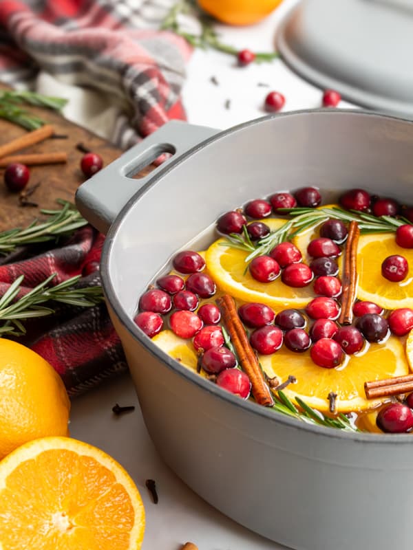 Jen's simmer pot with cranberries, orange slices, cinnamon sticks, and rosemary. 