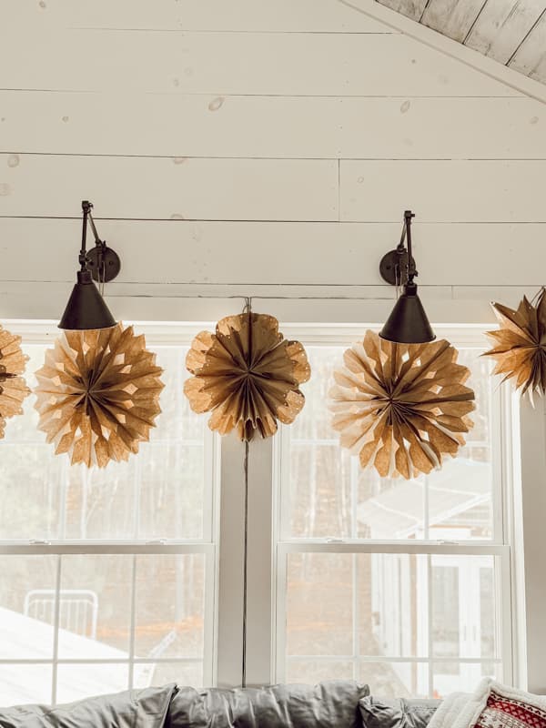 DIY 3-D Snowflakes over the window casing in farmhouse lofe.  