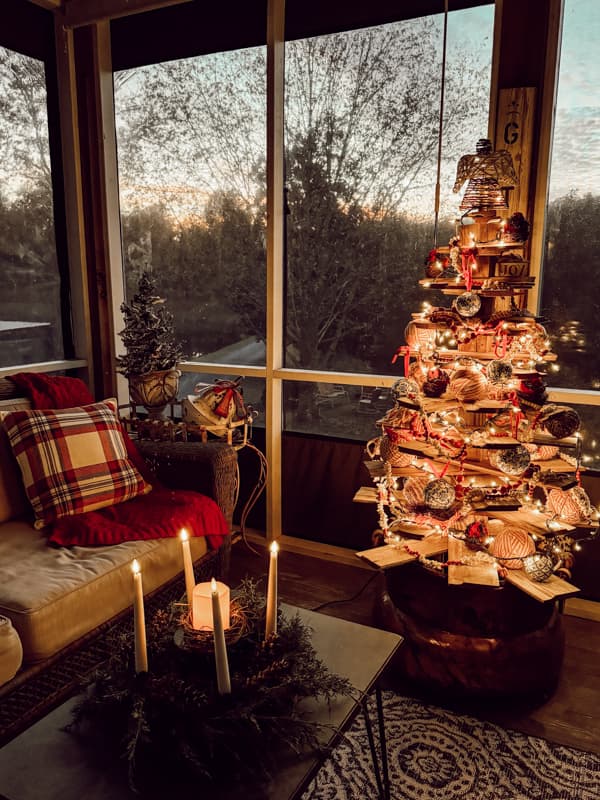 Shiplap Wood Christmas Tree for outdoor Christmas Decorating ideas on Screen Porch with advent wreath on coffee table.  