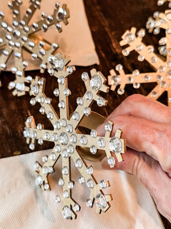 Tap rhinestones on napkin rings to ensure they are secure.  