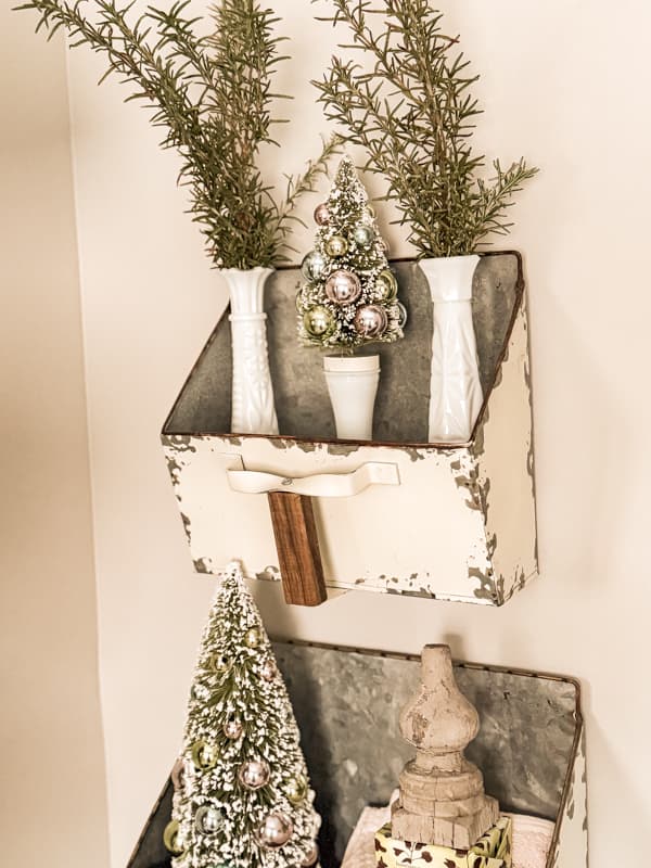 Add rosemary to vintage milk glass bud vases in wall planters on bathroom wall.