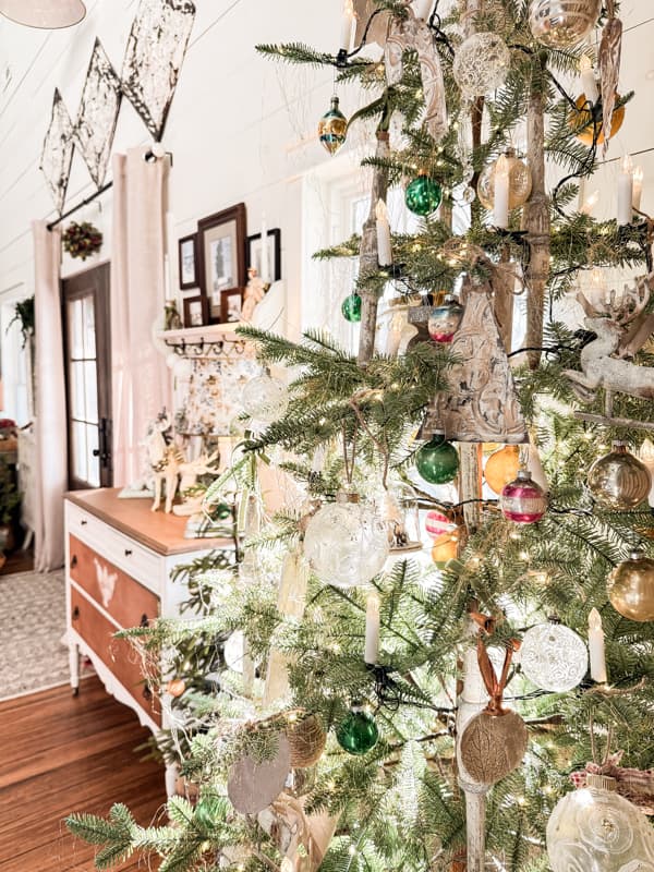 Christmas Tree with Vintage Architectural Salvage and Metal Ceiling Tiles above front doors.  