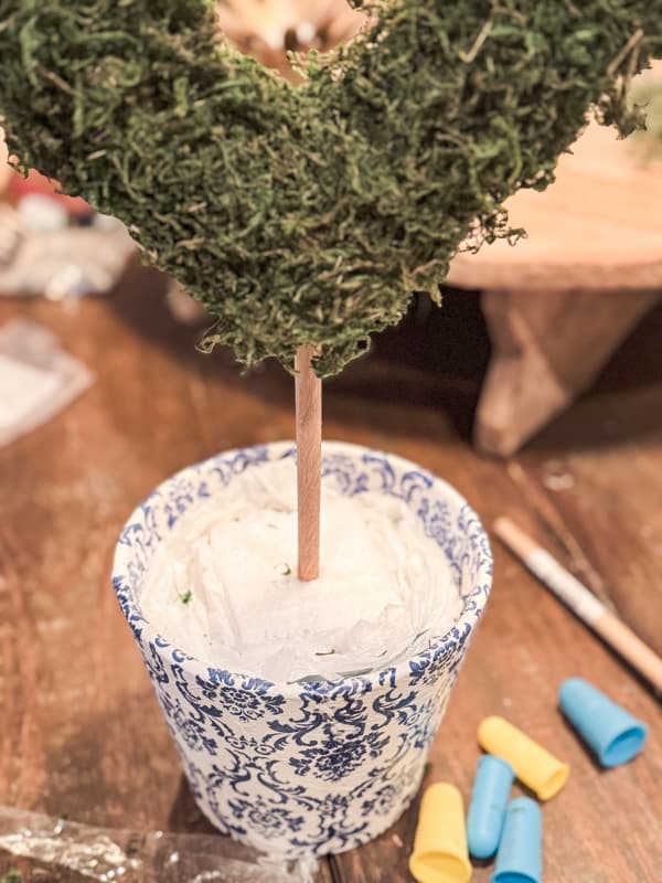 Moss Heart Topiary in napkin decoupage blue and white container.