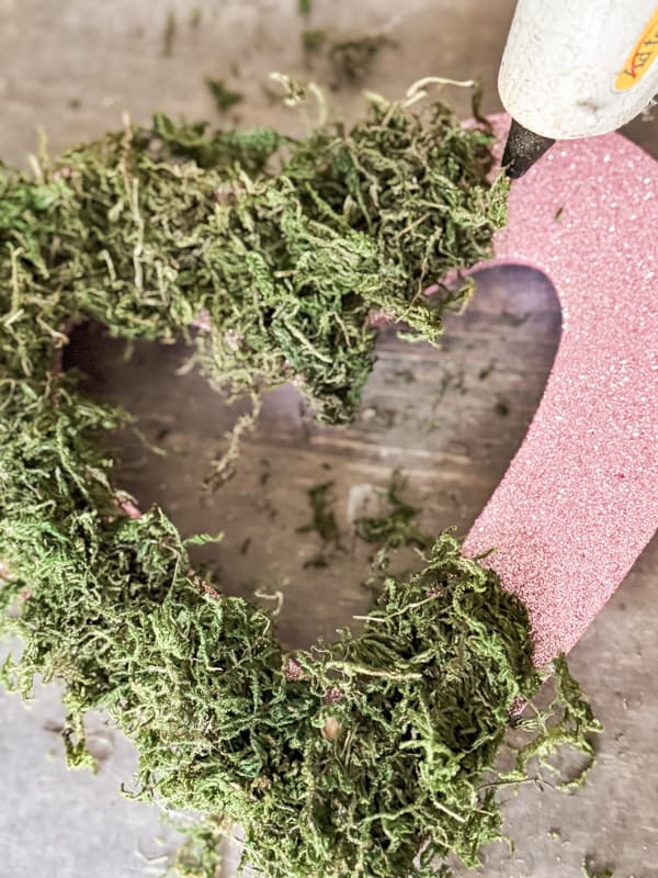 Adding reindeer moss to Dollar tree Valentine's Decor Styrofoam Heart.  