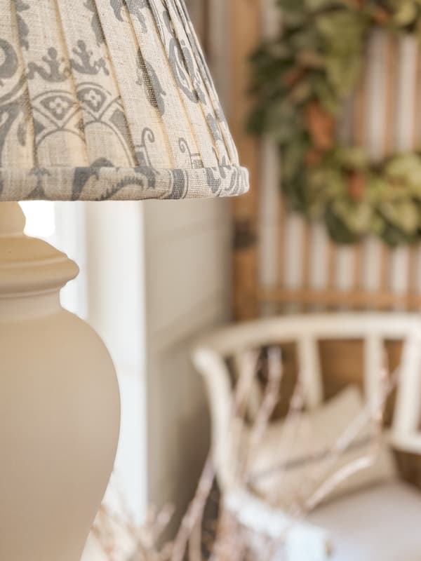 close up view of updated ginger jar lamp with blue and white shade.