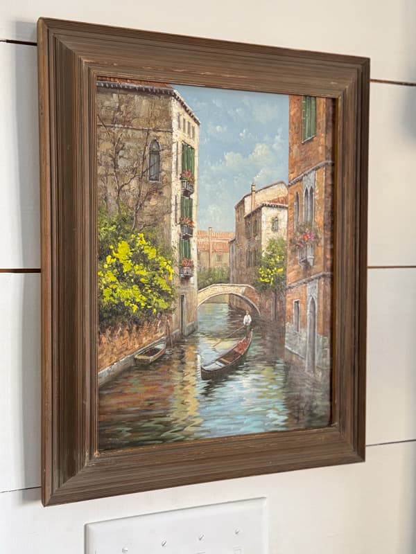 Framed painting from Italy on office wall